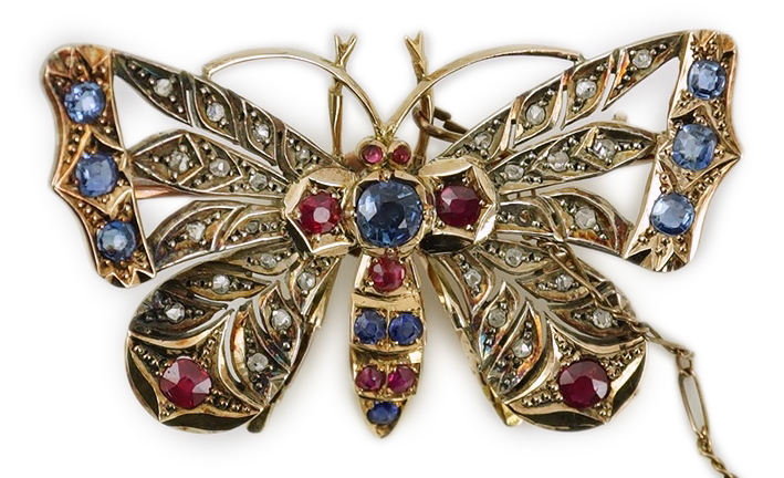 An Edwardian gold, ruby, sapphire and rose cut diamond set butterfly brooch